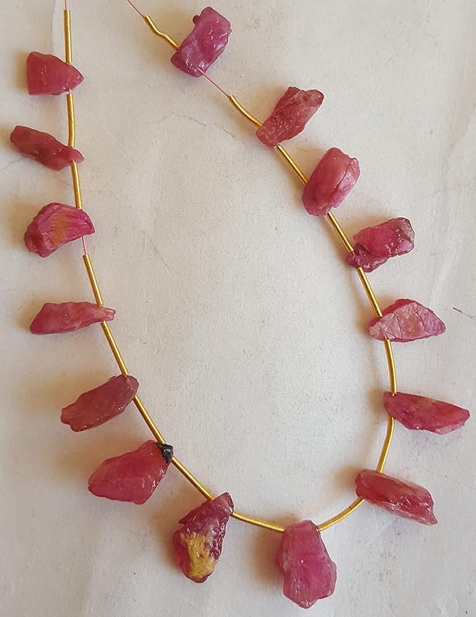 Strands featuring ruby gemstones, each bead measuring 6mm to 7mm, showcasing a rough, natural texture.