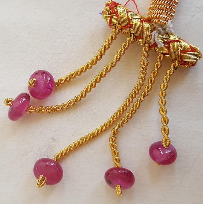 Strand featuring smooth rondelle ruby gemstones, 8mm, in a stunning pink hue.