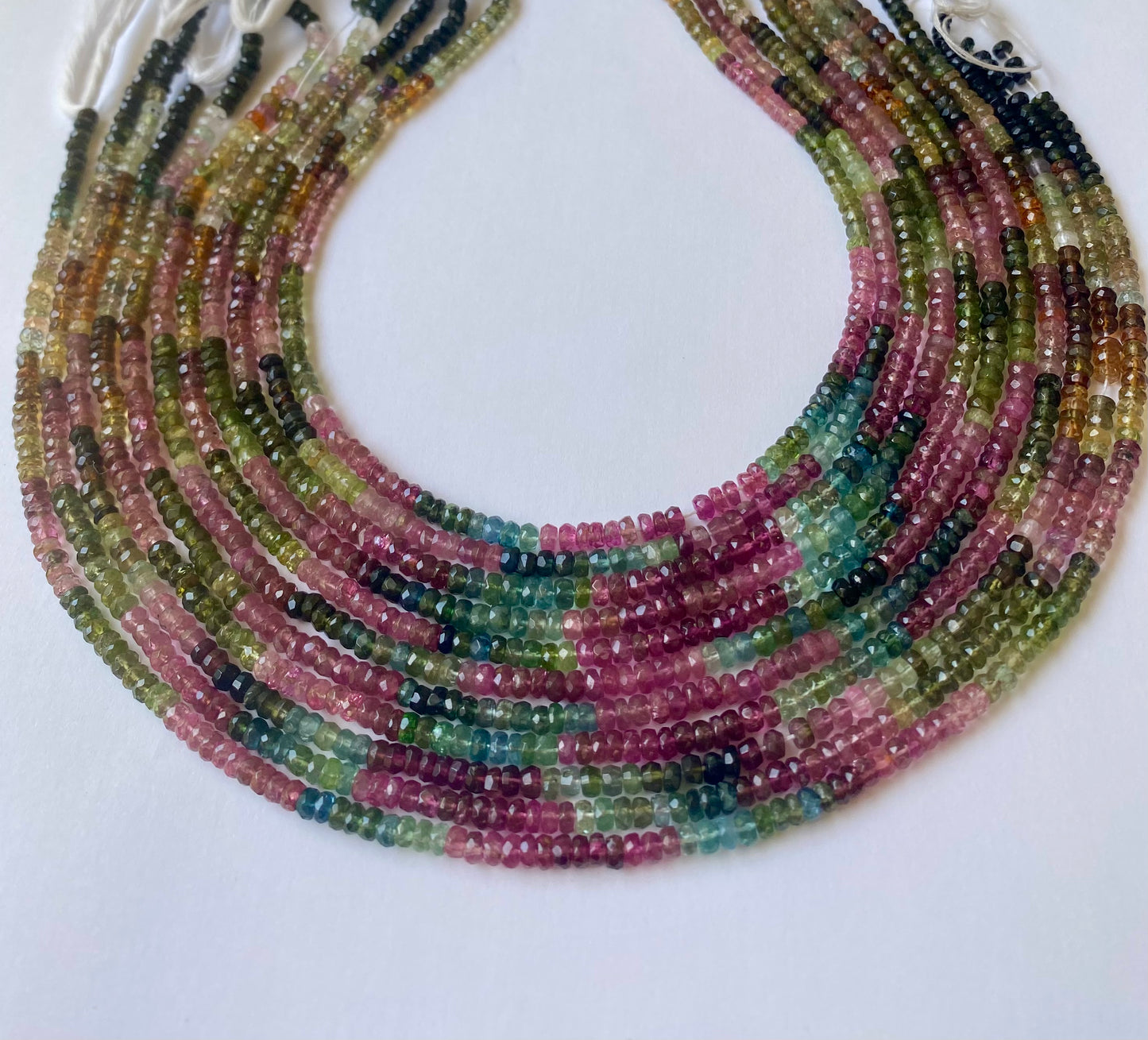 Multicoloured tourmaline beads, each measuring 3.5-4mm in size,