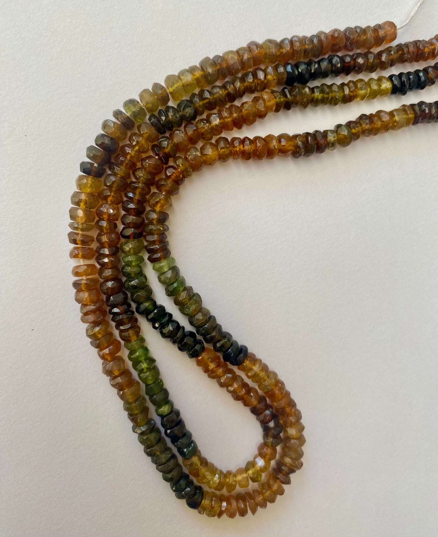 Vibrant multi-strands featuring 4.5-5mm faceted rondelle tourmaline beads in various colours, highlighting their beauty.
