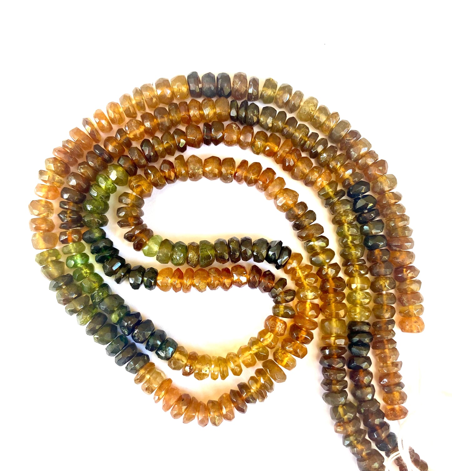 Multi-strands made of 4.5-5mm faceted rondelle tourmaline beads, displaying a stunning array of colours and textures.