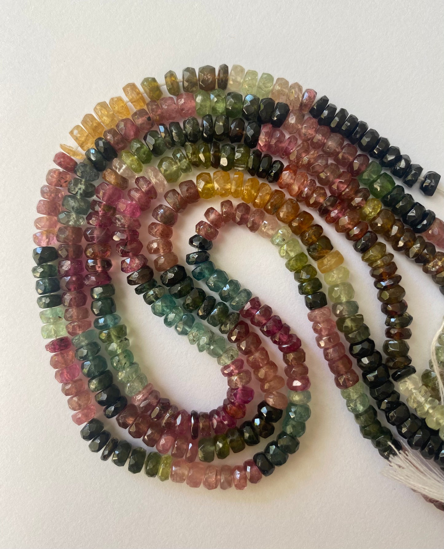 A strand of faceted multicoloured tourmaline beads, rondelle shape, measuring 4.4-4.8mm in size.