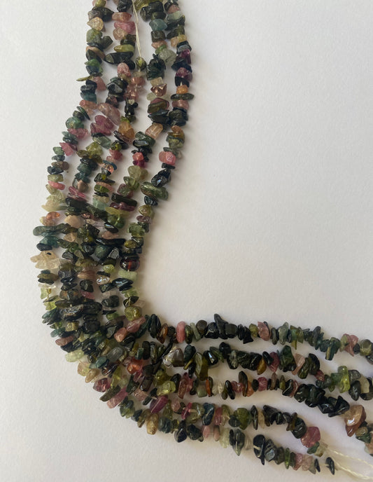 Crafted from 3-6mm rough green and pink tourmaline beads.