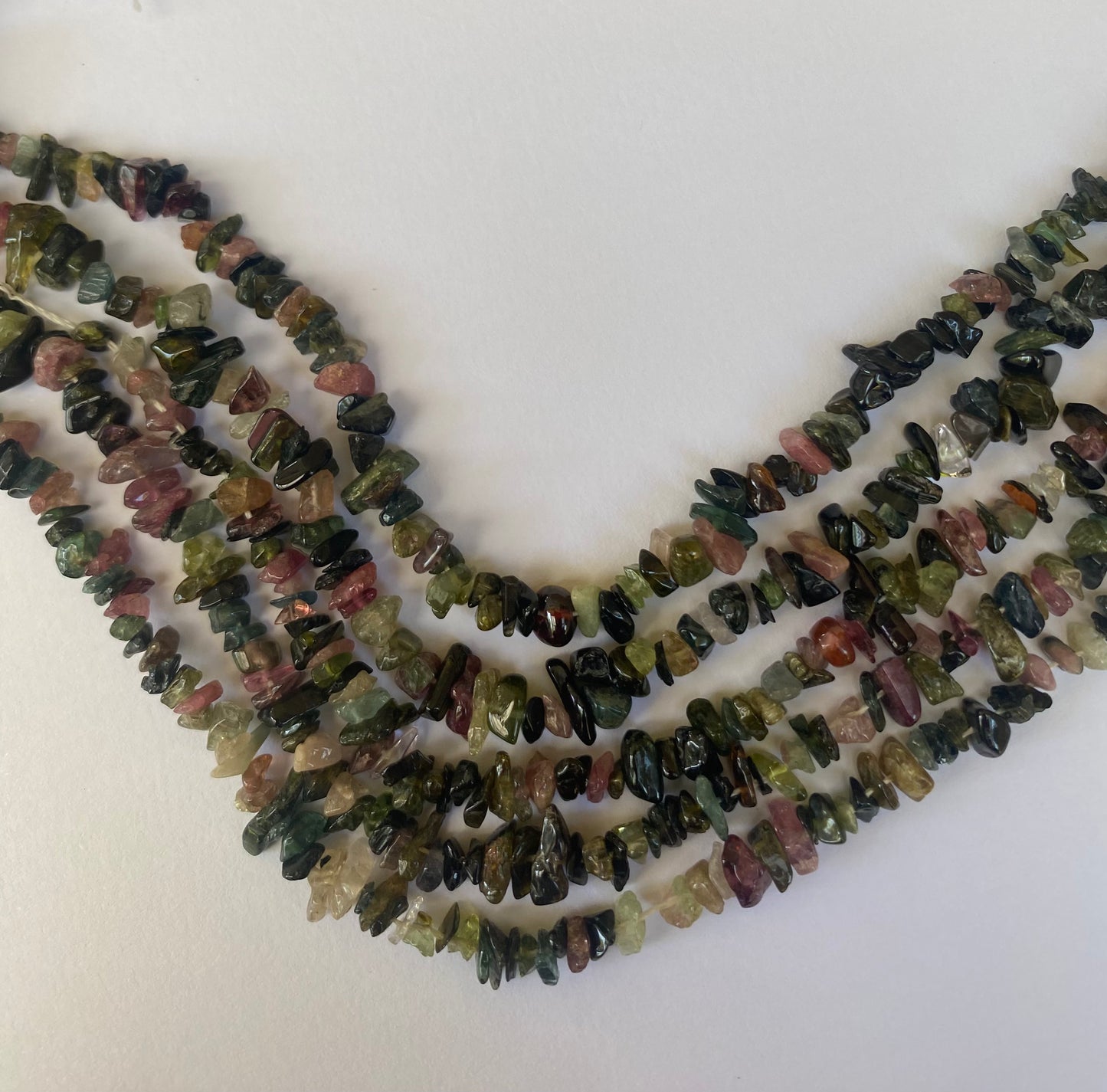Featuring rough green and pink tourmaline rough beads, measuring 3-6mm in size.