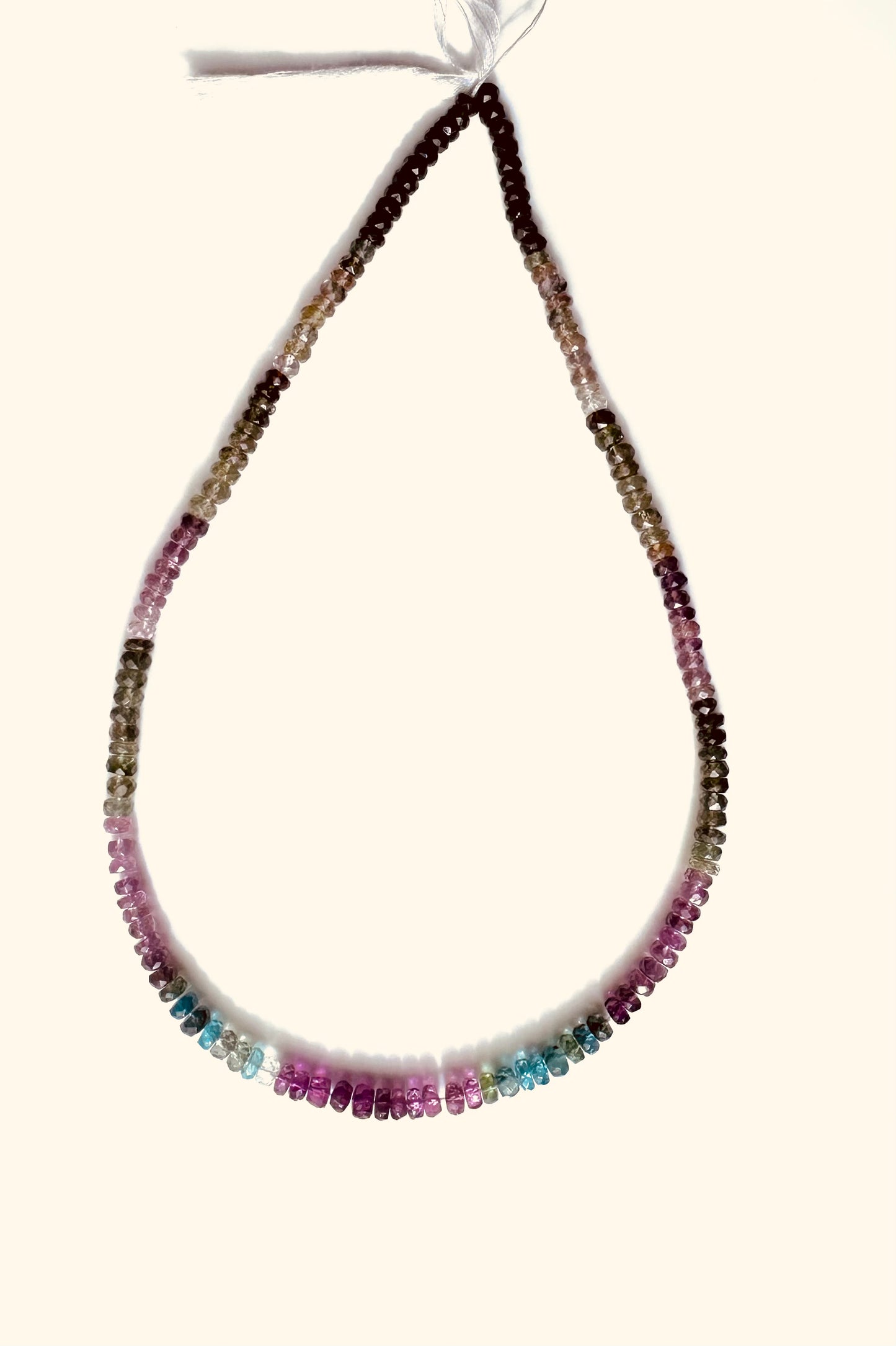 Single strand necklace made of multi-coloured tourmaline beads, each measuring 3.5-4mm in size.