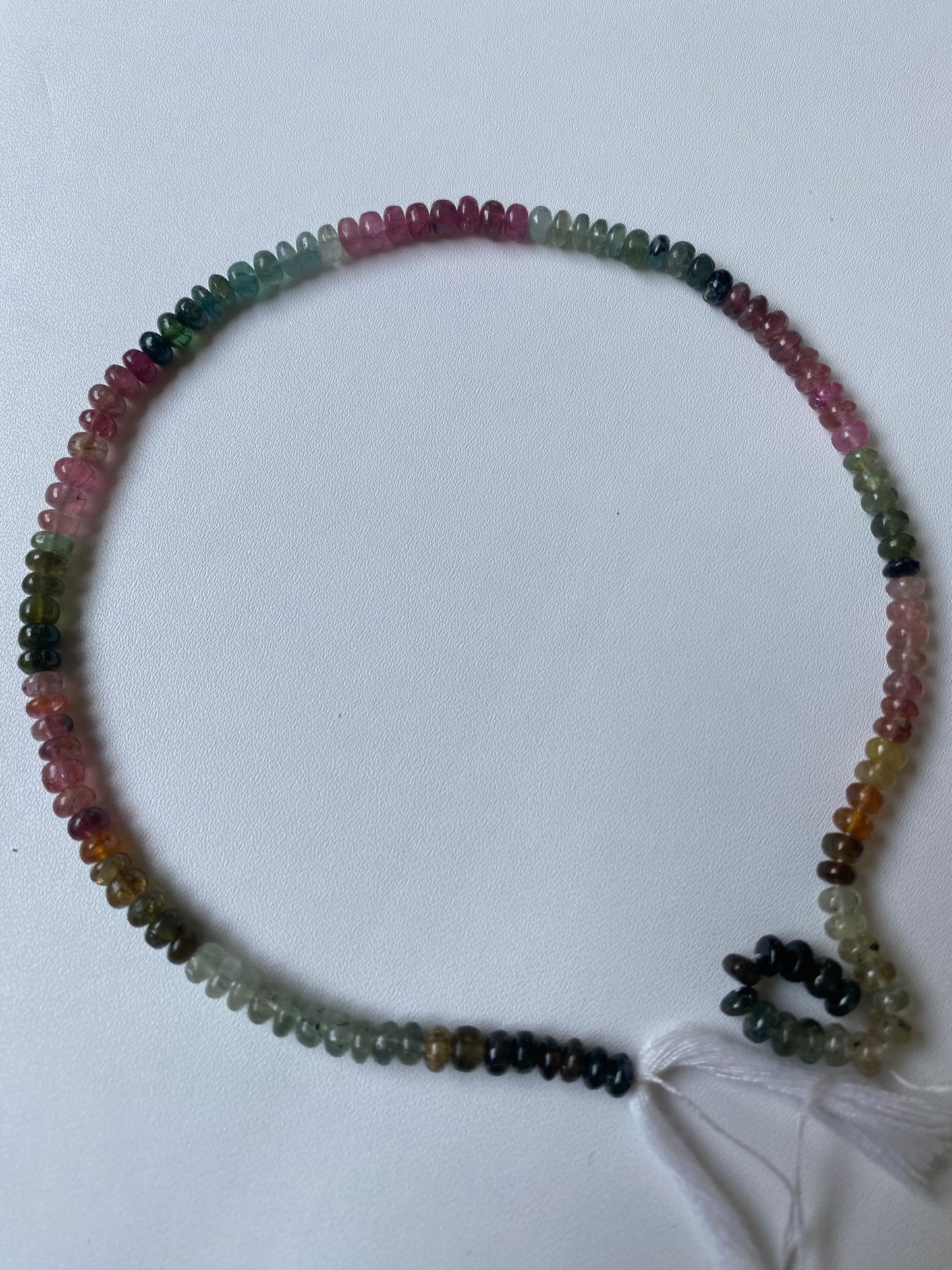 Vibrant multi-strand featuring 5mm tourmaline beads in various colours, highlighting their beauty.