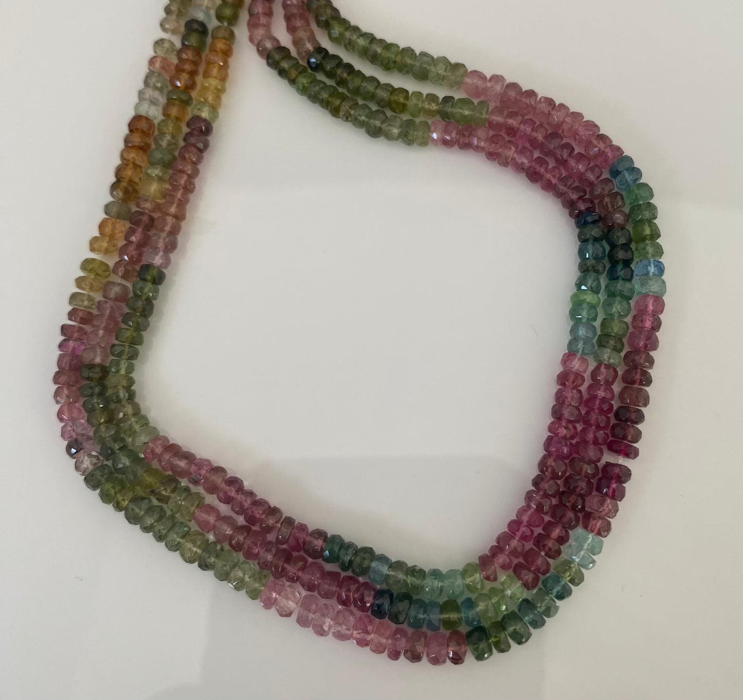 Vibrant row of micro-cut watermelon tourmaline beads