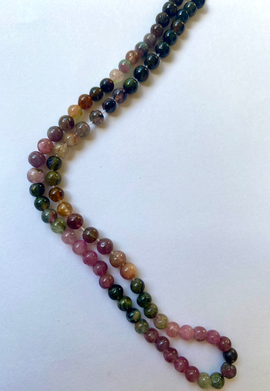 Colourful strand made of 4.5mm smooth spherical watermelon tourmaline beads, showcasing a beautiful blend of hues.