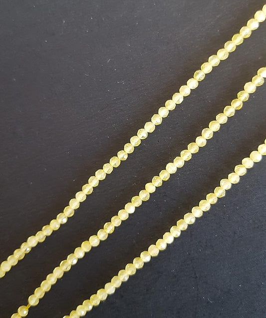 A strand of faceted Chalcedony rondelle gemstone beads, measuring 2.5mm, showcasing their vibrant colour and shine.