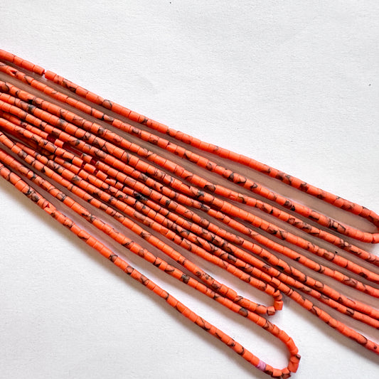 Close-up of faceted Afghan Heishi beads revealing natural shine and precision cutting.