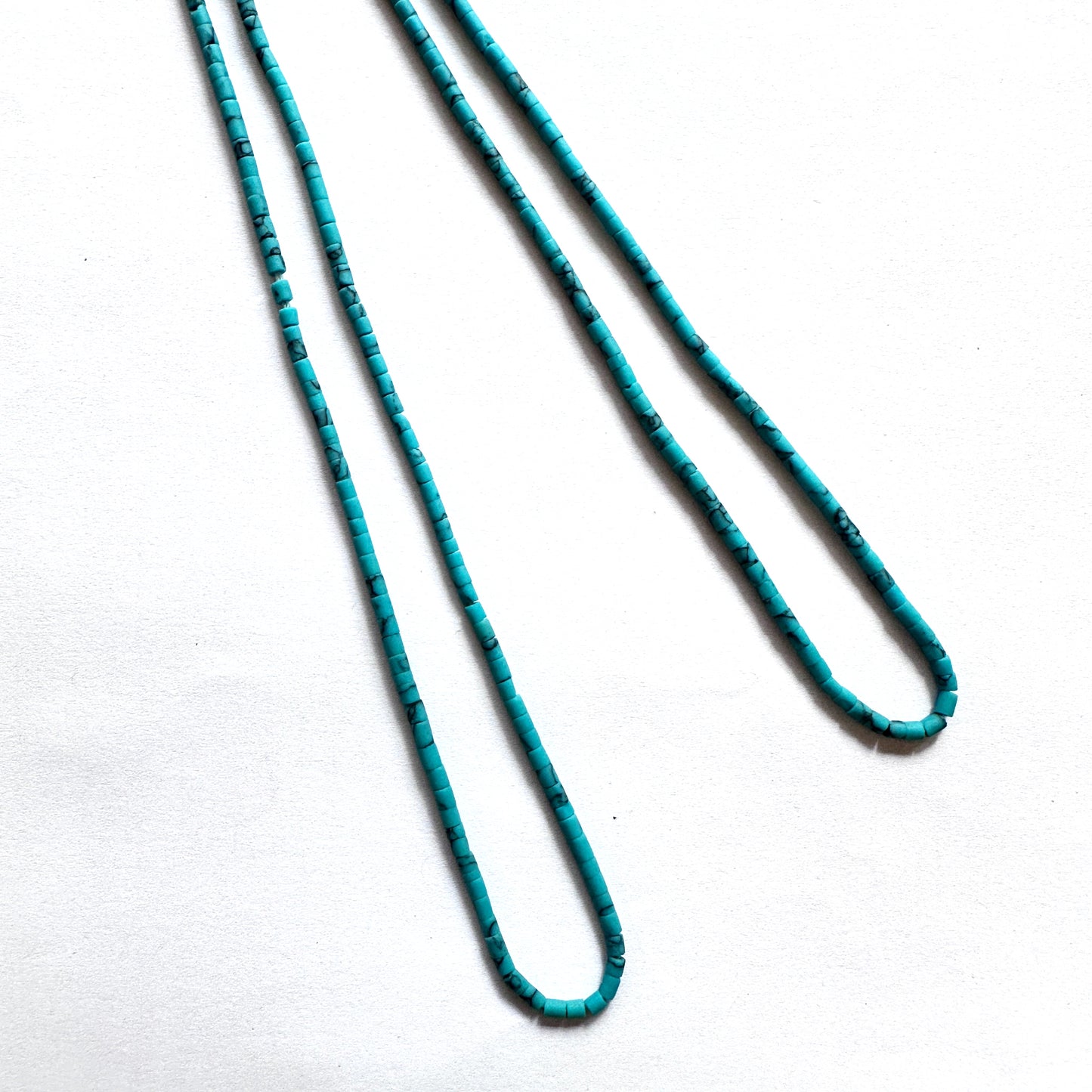 Afghan Heishi tube beads with 2–2.2mm size and smooth cylindrical cut on a 31cm strand.