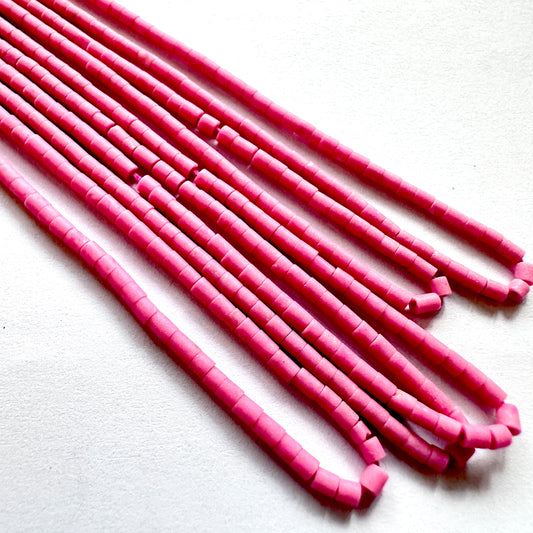 Pink Afghan beads on a white background
