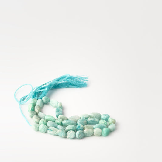 Authentic Amazonite gemstone beads in 5.5–6mm tumble‑smooth shapes with soft aqua tones for DIY jewellery makers.