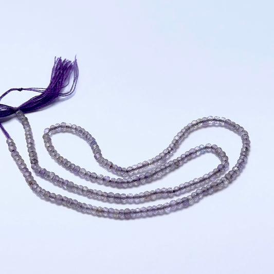 Amethyst 2.4mm faceted rondelle beads arranged on a strand, showing crisp faceting and rich purple tones.
