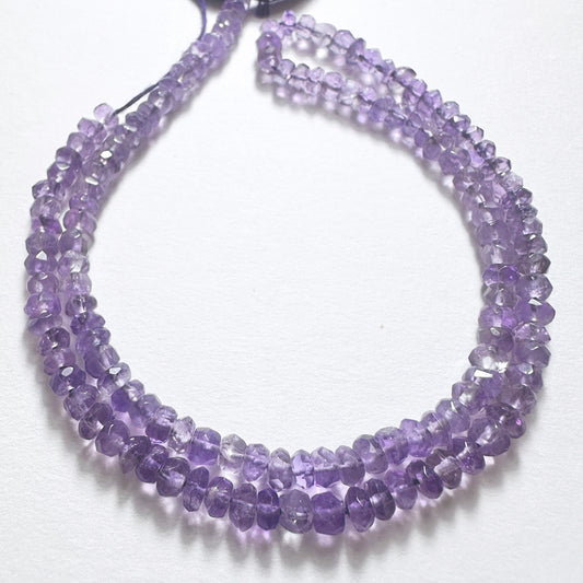 Close-up of 4.1mm Amethyst stone beads showcasing their clarity, cut and handmade jewellery component quality.