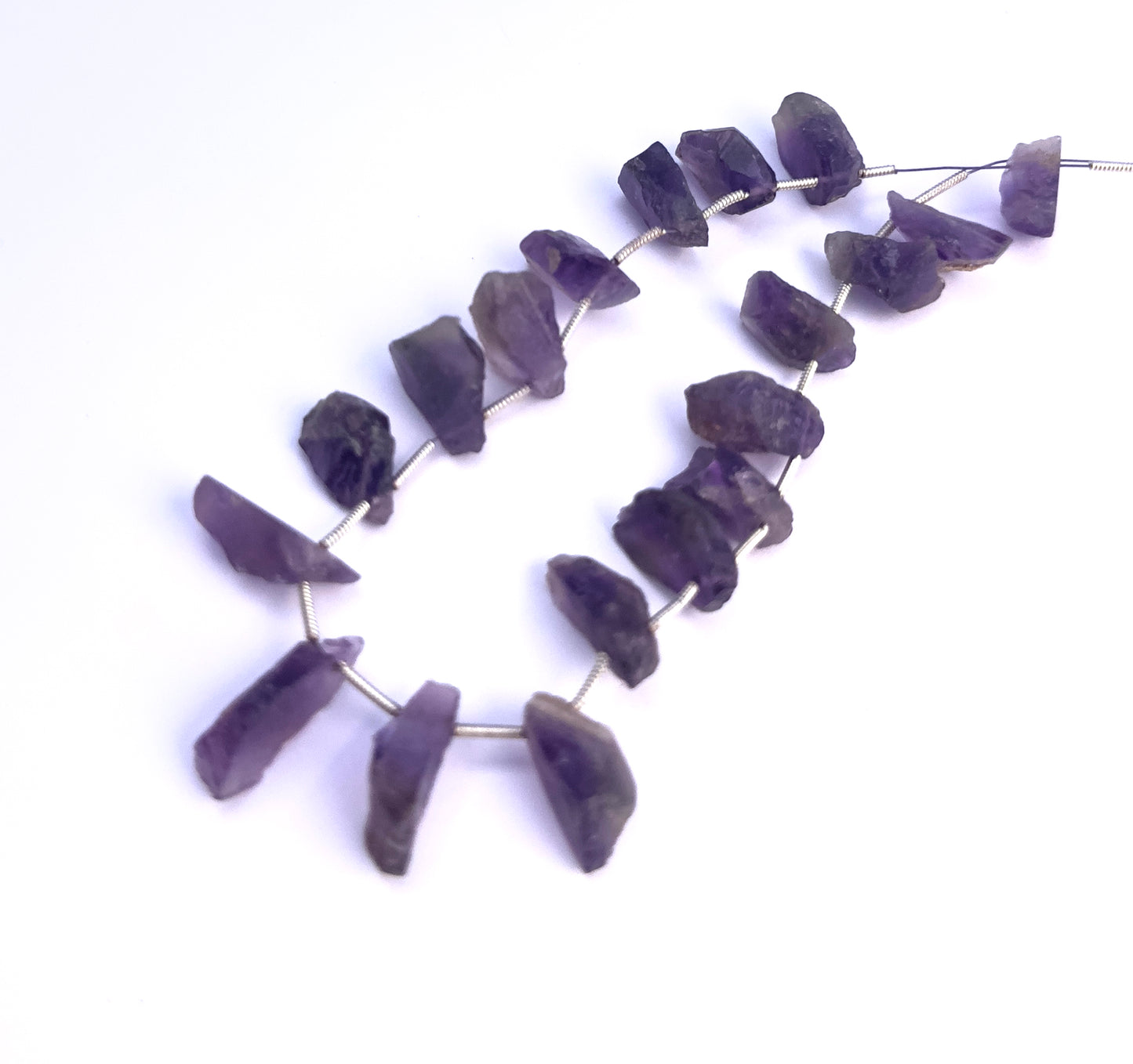 Natural Amethyst stone beads with irregular shapes and organic character.