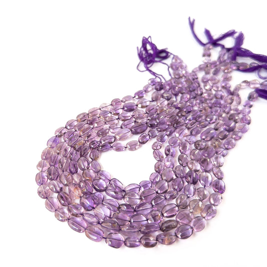 Genuine Amethyst smooth oval beads in 6.5–7mm and 7–8mm sizes, ideal for DIY gemstone jewellery making.