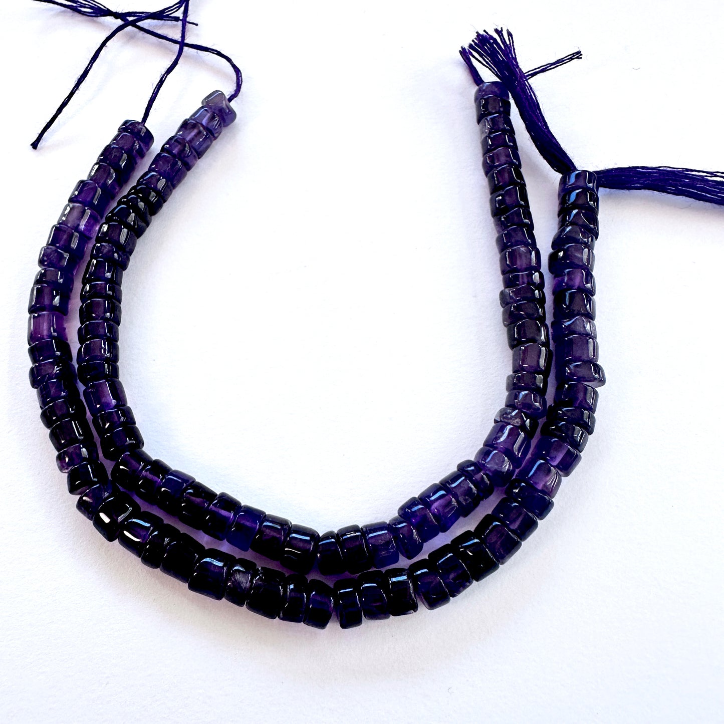 Handmade jewellery components featuring 5.5mm Amethyst stone beads with smooth wheel cut.