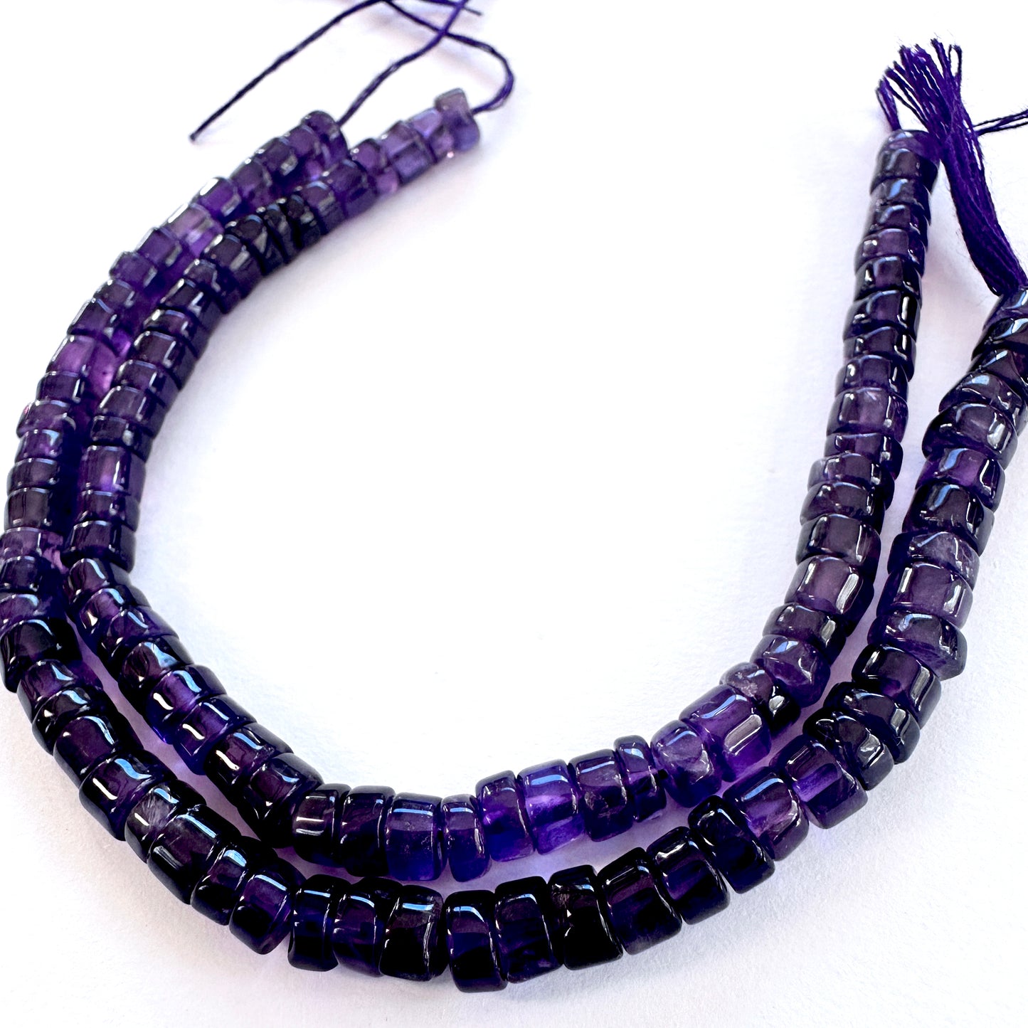 High-quality Amethyst natural gemstone beads with sleek wheel shape and clarity.