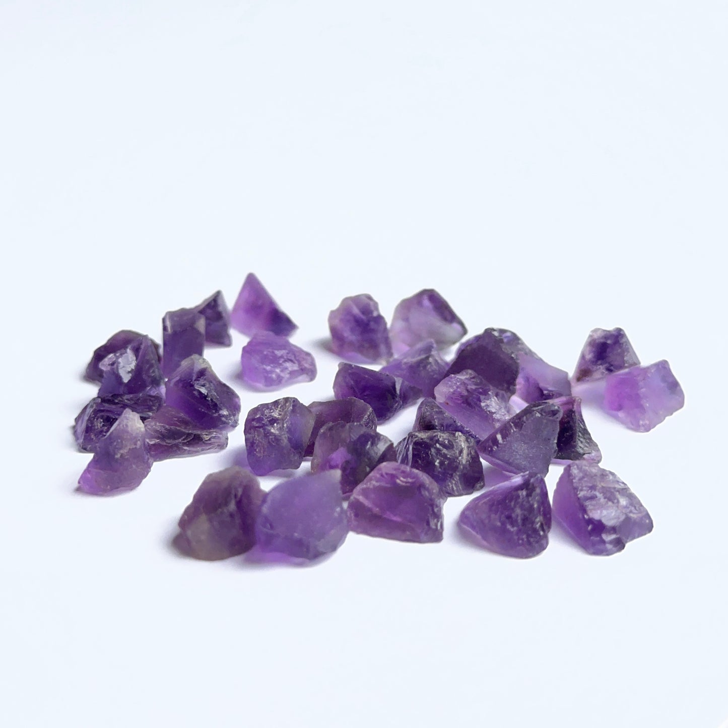 Undrilled amethyst rough photographed to show deep purple tones and raw handcrafted appeal.