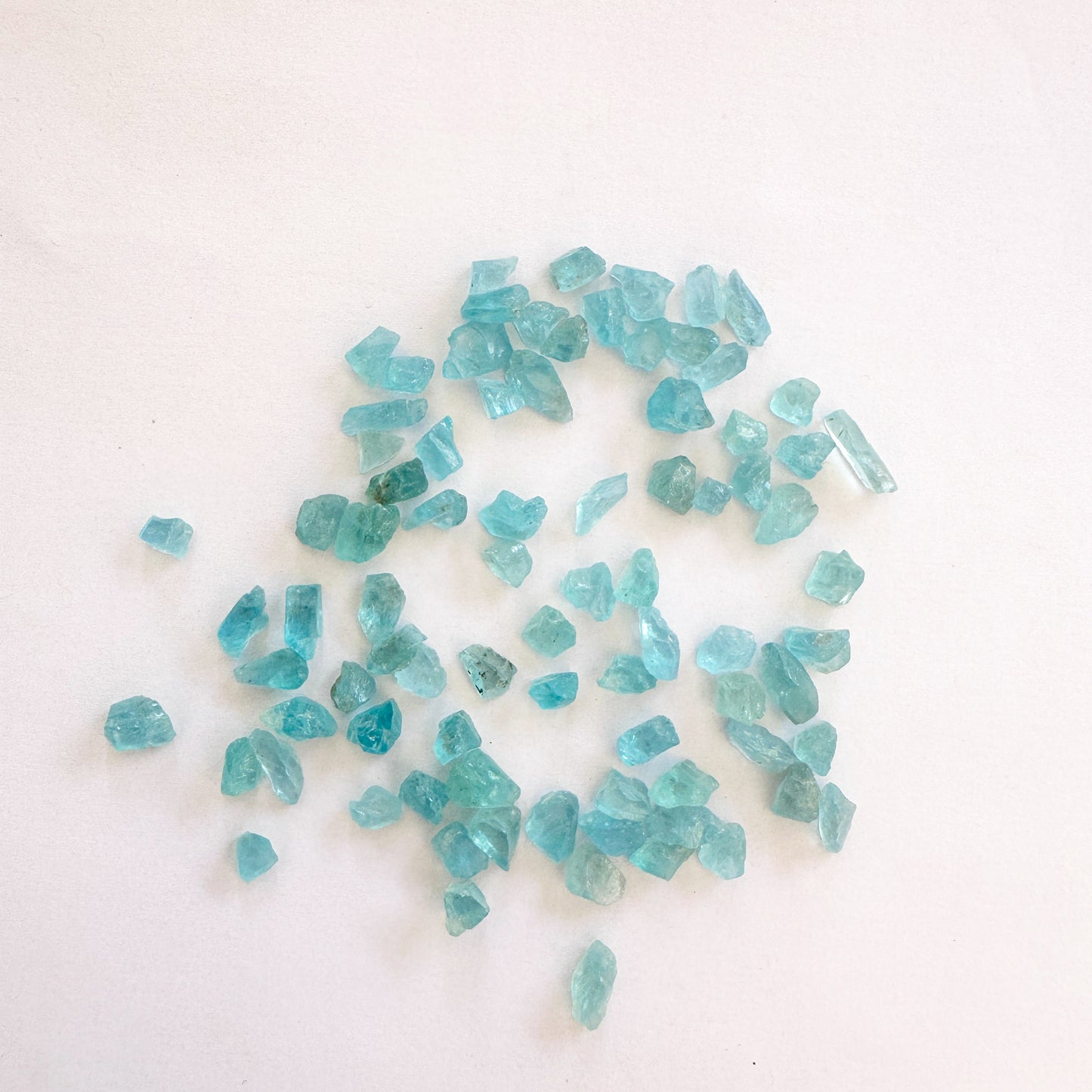 A dial gauge measures the Apatite rough cut 4.5mm gemstone.