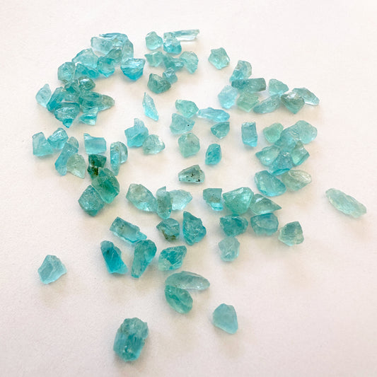 Close-up of 4.5-5mm Apatite gemstones showing natural texture and shine.