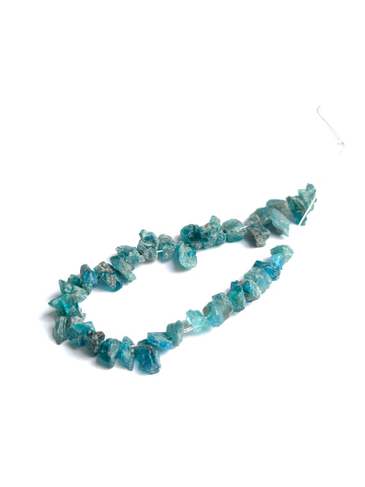 Apatite rough beads photographed to show their unpolished finish and suitability for handmade jewellery components.