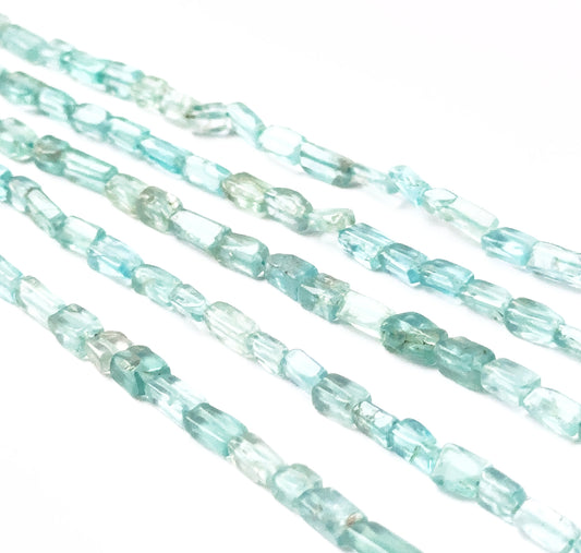 Apatite smooth rectangle heishi gemstones with clean geometric shaping and bright aqua colour across a 33cm strand.