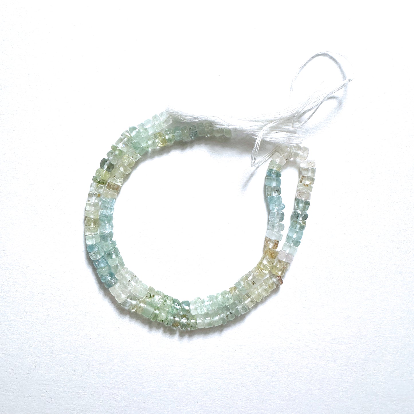 Natural gemstone beads in aquamarine blue, smooth wheel cut, 4.5-4.8mm, perfect for DIY jewellery and elegant designs.