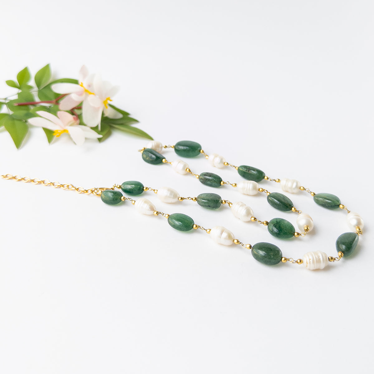 Beryl gemstone necklace with natural colour variation and pearl accents, perfect for elegant everyday wear and special occasions.