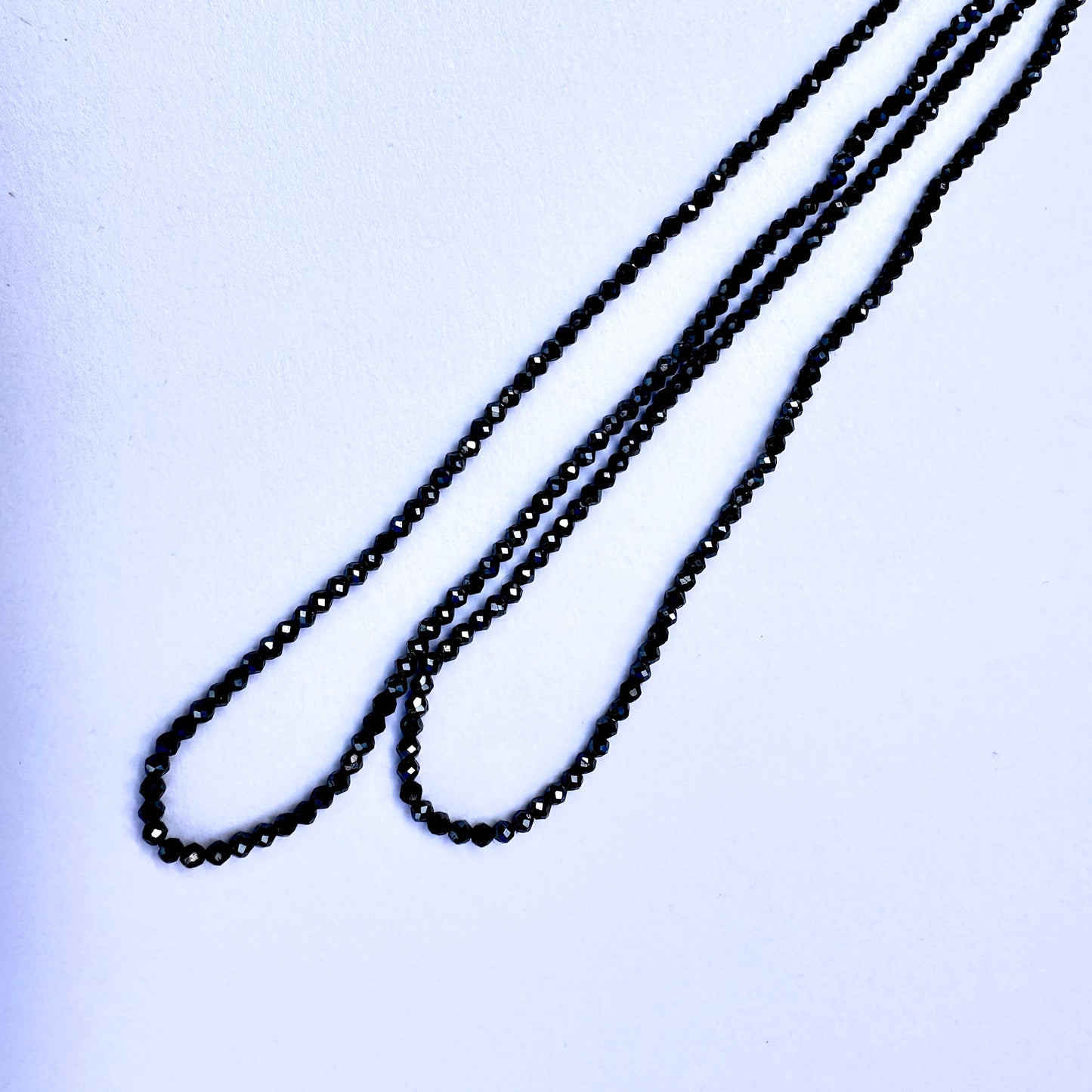 Natural gemstone beads in coated Black Spinel, 2.1mm size, ideal for elegant DIY jewellery designs.