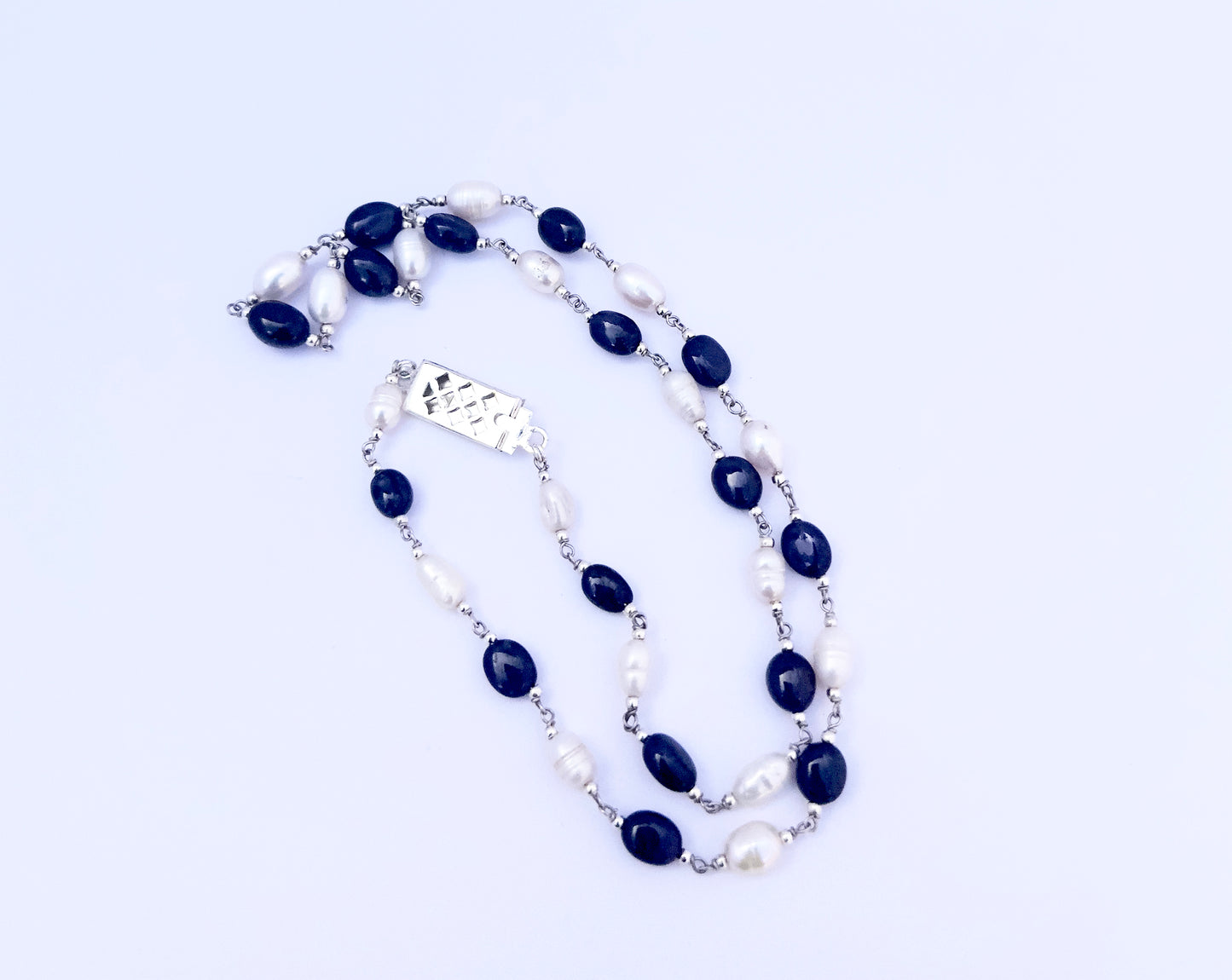 Stone beads necklace featuring 97 carats of smooth oval Sapphire and Pearls in classic hues.