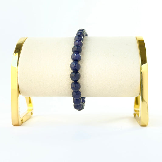 Elegant smooth round blue sapphire bead bracelet crafted in a single adjustable strand.