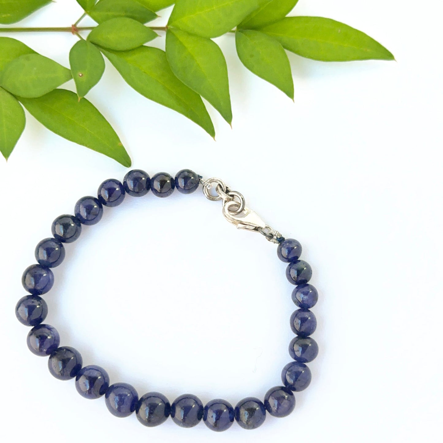 Blue sapphire bead bracelet arranged in a classic 16cm smooth round style.