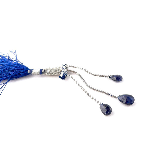 Genuine Blue Sapphire briolette gemstones featuring rich navy tones and crisp faceting across three polished pieces.