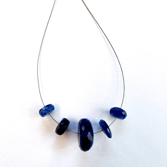 Close-up of Blue Sapphire faceted rondelle beads, 7.5-14mm, showcasing brilliance and precision cut for DIY jewellery.