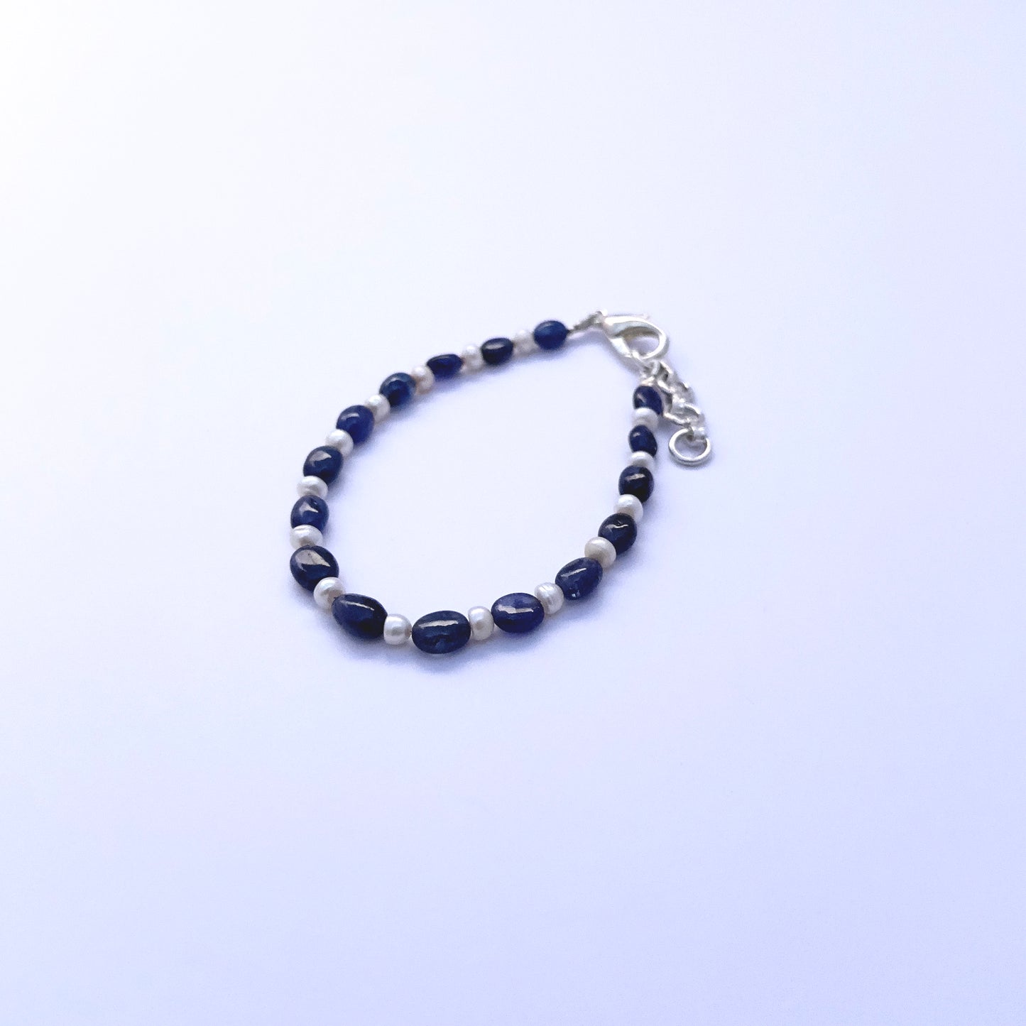 Elegant bracelet featuring 41 carats of sapphire and pearls with 2cm extension clasp.