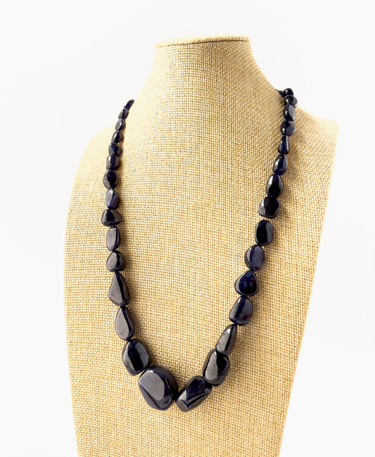 Genuine Blue Sapphire tumbled beads with rich colour variation and smooth texture, crafted into a bold 700‑carat adjustable necklace.