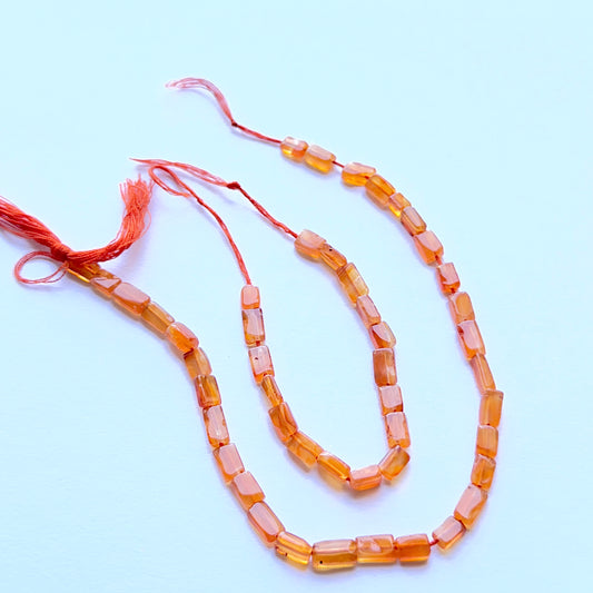 Close‑up of 4.1–4.5mm Carnelian stone beads showing polished rectangular cuts ideal for natural gemstone beads for DIY jewellery.