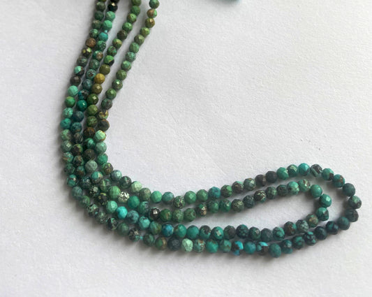 32cm strand of Chrysocolla beads aligned neatly to reveal shine and consistent sizing.