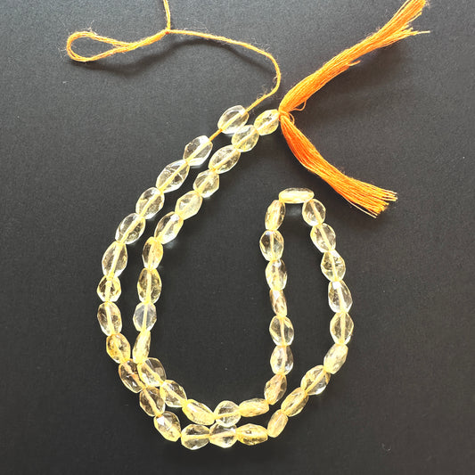 Stone beads with faceted Citrine arranged neatly, ideal for handmade jewellery components.