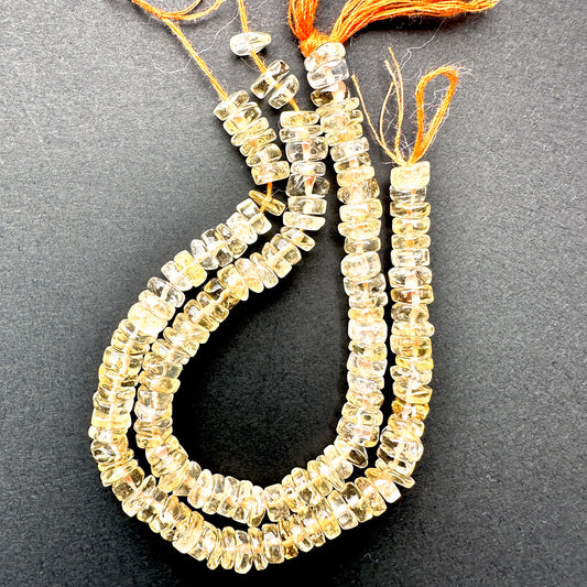 Close-up of Citrine stone beads showing smooth cut and natural gemstone shine.
