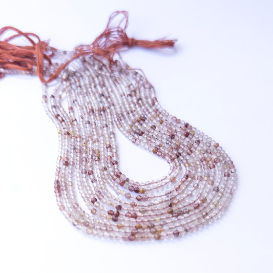 Premium Copper Rutile gemstone beads in faceted rondelle cut arranged in strands, showcasing warm tones for jewellery designers.