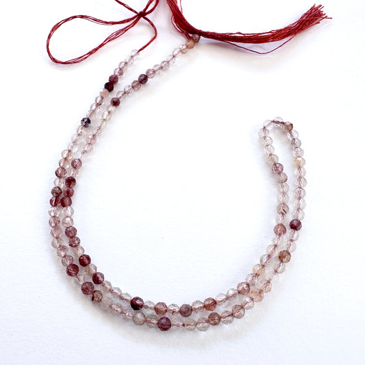 Natural gemstone beads in Copper Rutile, arranged on a 31cm strand with consistent cut.