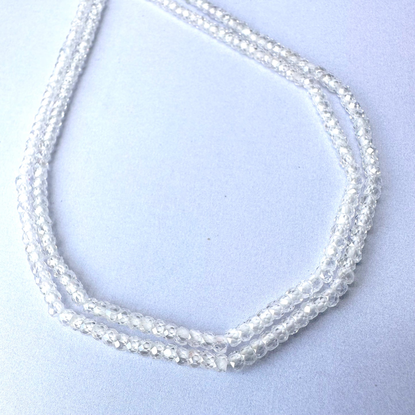 Close-up of Cubic Zirconia beads showing brilliant sparkle and polished facets.