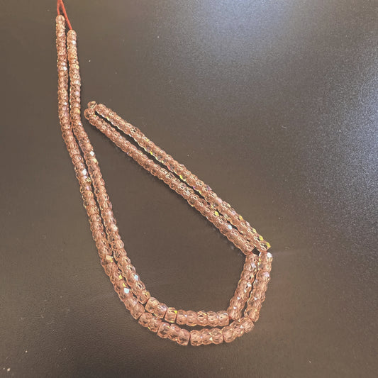 Close-up of 3mm Cubic Zirconia rondelle beads showing precision faceting and crystal-clear shine.