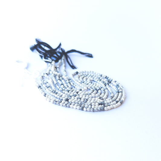 Handmade jewellery components featuring smooth, sparkling Dendrite Opal rondelle gemstone beads.