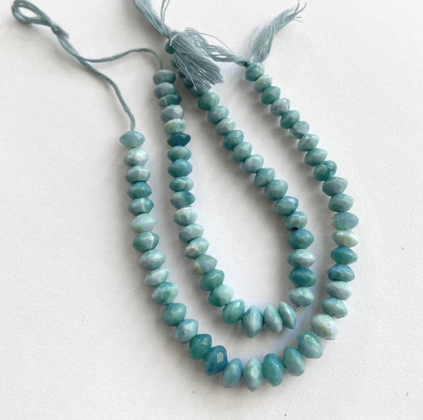 Denim opal rondelle beads with 0.5mm holes, ideal for jewellery making and artisan crafts.