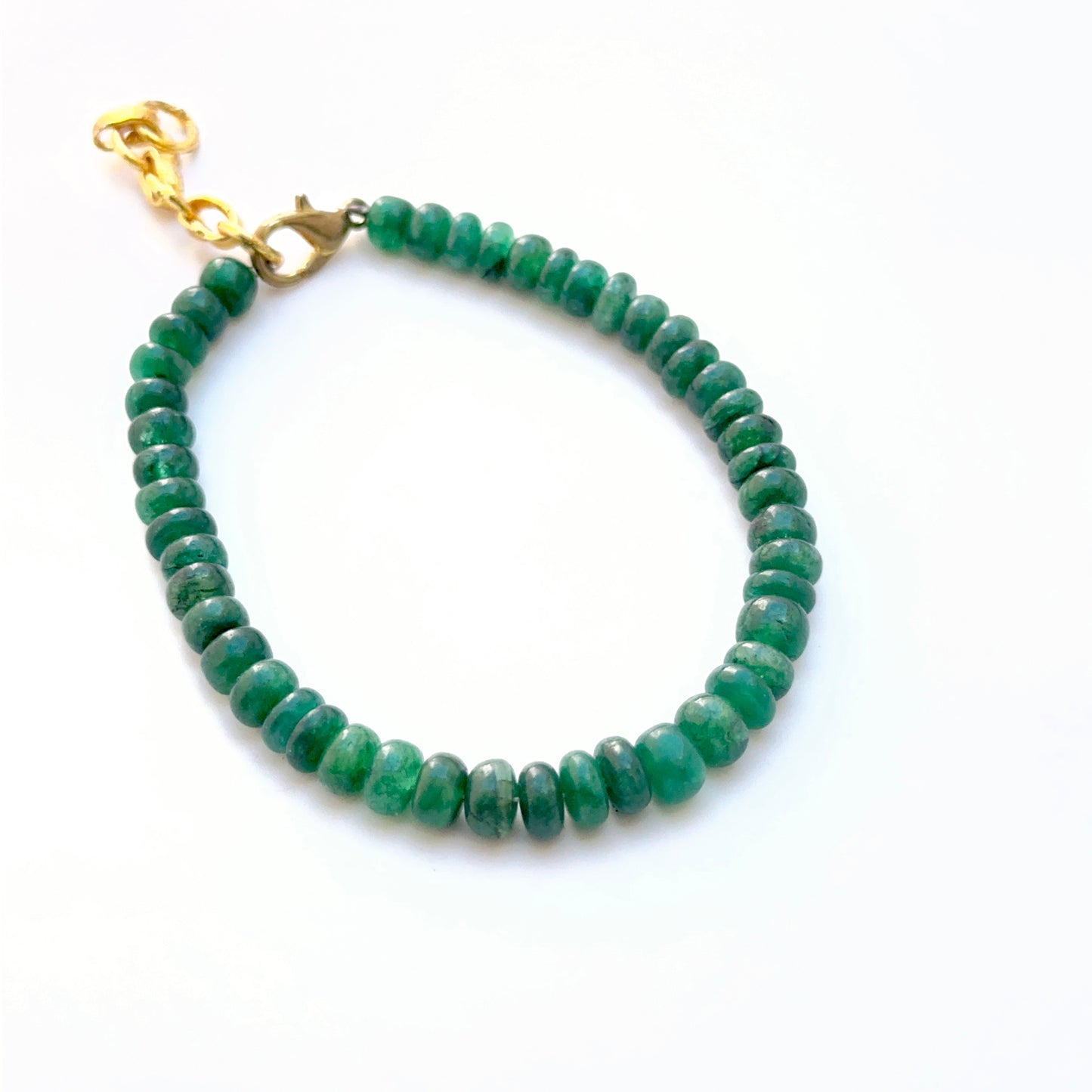 Emerald bracelet with smooth rondelle beads showing shine and colour.