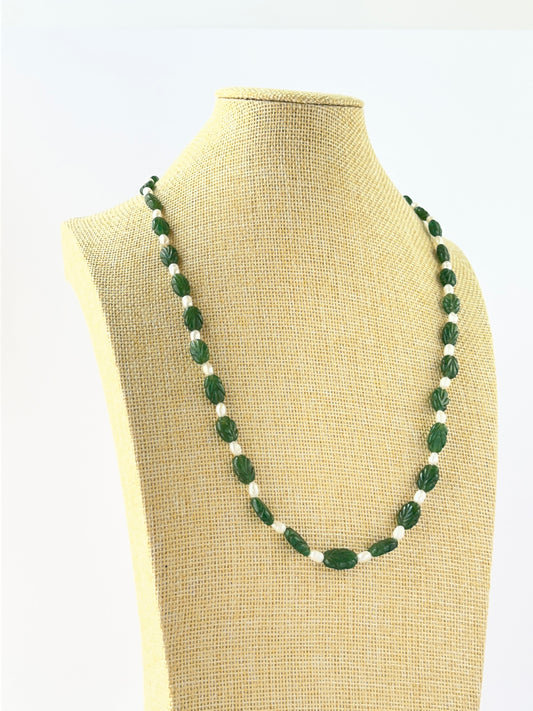 Elegant emerald necklace crafted with carved oval beads sized 8–8.5mm and finished with an adjustable clasp.